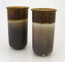 pair of cilinders made in stoneware with pre columbian inspiration and simbols decoration, par de cilindros de ceramica alta temperatura pero con inspiracion prehispanica en los simbolos que la decoran